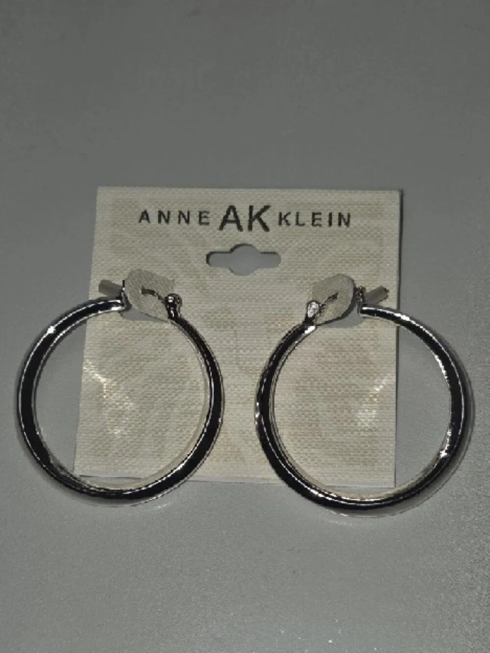 Anne Klein Shiny Silver Rounded Hoop Earrings